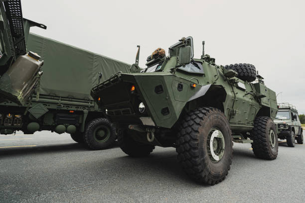 Armed Forces Convoy Armed Forces personnel provide disaster relief. armored vehicle stock pictures, royalty-free photos & images