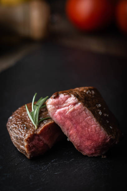 istock rare grilled tenderloin beef steak on cutting board with vegetables 1174267714