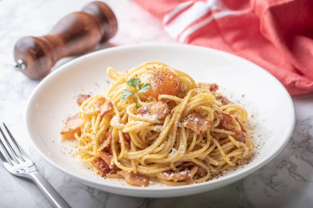 istock carbonara spaghetti with raw egg yolk on top 1174268180
