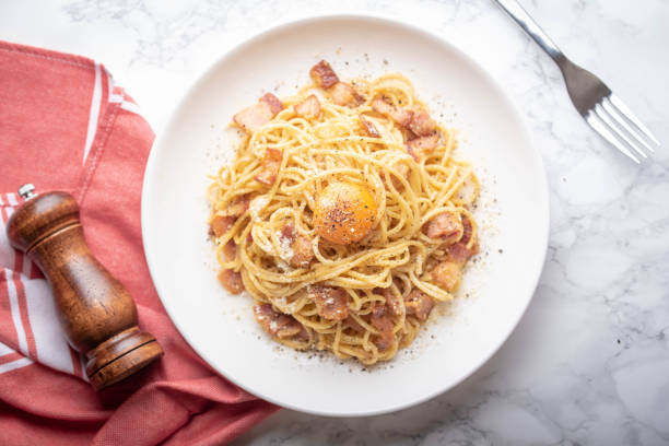 istock carbonara spaghetti with raw egg yolk on top 1174268952