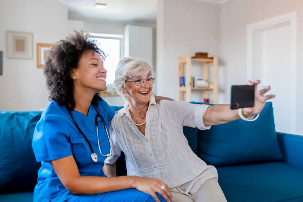 istock Female Nurse and Elderly Patient Taking a Selfie 1174269044