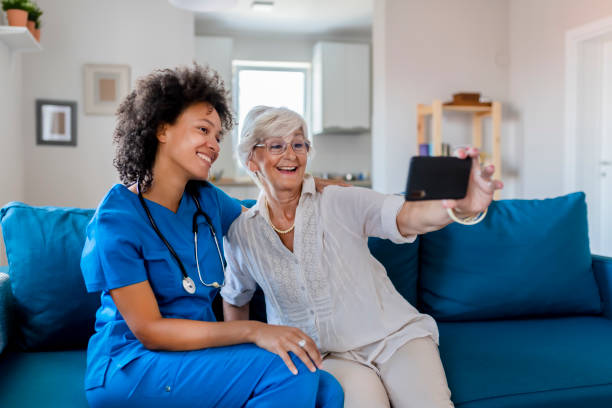 istock Female Nurse and Elderly Patient Taking a Selfie 1174269523