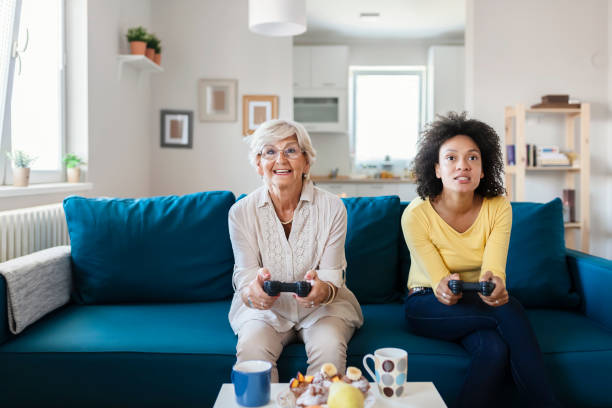 istock Mother and Daughter Playing Video Console Game 1174269533