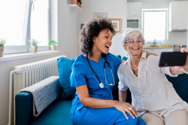 istock Female Nurse and Elderly Patient Taking a Selfie 1174269556