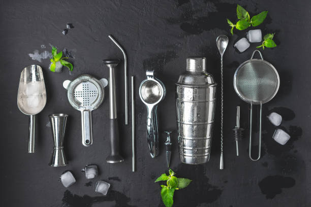 istock Accessories for making cocktails ,shaker, glass, jigger, filter, scoop, straws, spoon bar , mudler, geyser, strainer, ice cubes , mint leaves 1174271634