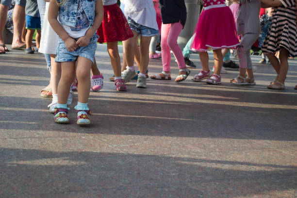 istock Children's feet one by one. 1174274564