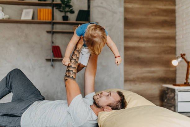 istock Father and son playing in morning 1174277982