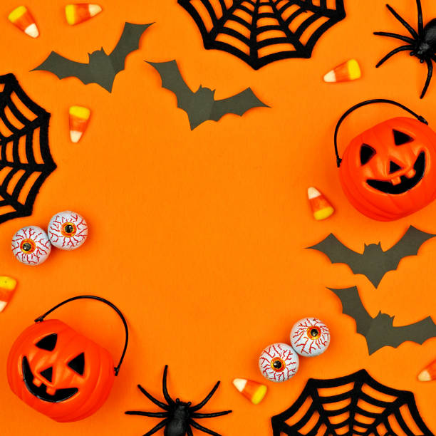 istock Halloween decor square frame over an orange background with copy space 1174280173