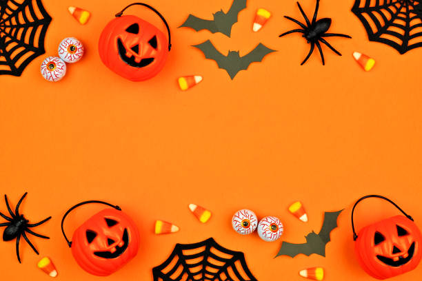 istock Halloween decor double border over an orange background with copy space 1174280401