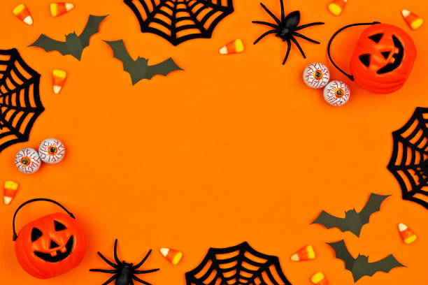 istock Halloween decor frame over an orange background with copy space 1174280598