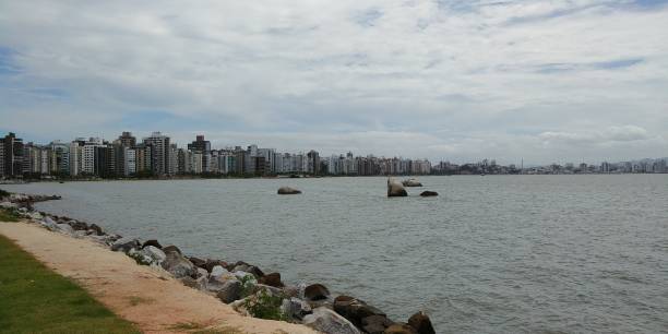 istock A nice stroll through the downtown Florianopolis boardwalk on a cloudy summer day. 1174282399