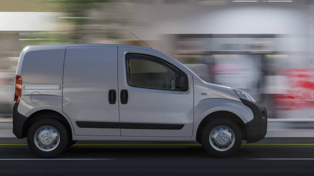 istock White Mini Van on the Main Street in the Evening 1174289108