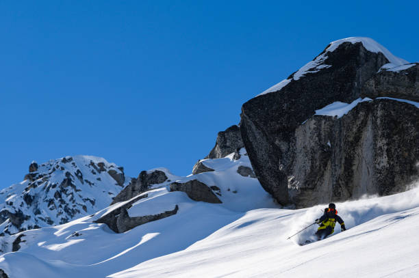 istock Skiing fresh powder on a ski vacation 1174289253