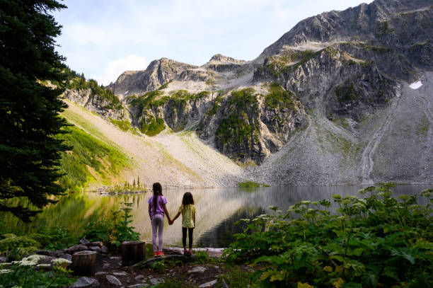 istock Siblings enjoying beautiful nature during hiking 1174289419