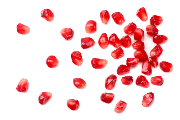 istock pomegranate seeds isolated on white background. top view 1174291449