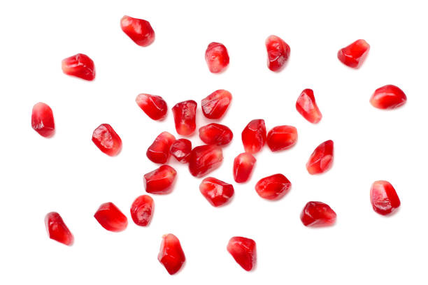 istock pomegranate seeds isolated on white background. top view 1174291480