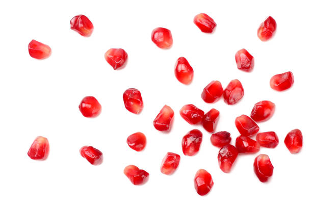 istock pomegranate seeds isolated on white background. top view 1174291580