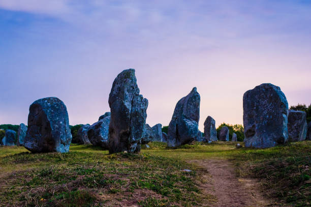 Ancient menhir granite stones at night. Carnac, France