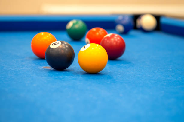 istock Colorful billiard balls on blue table, billiards game and fun 1174293206