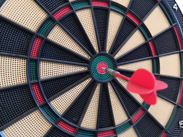 istock game of darts hanging on the wall 1174293556
