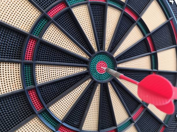 istock game of darts hanging on the wall 1174293563