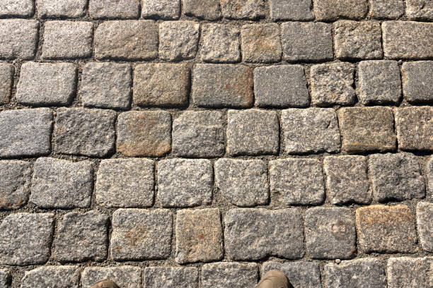 istock Texture of cobblestone in old town 1174293576