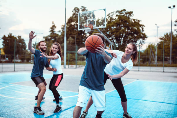 istock Couples Having A Friendly Competition In Basketball 1174294646