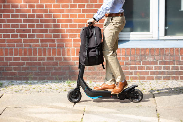 istock Young Man Riding An Electric Scooter 1174295169