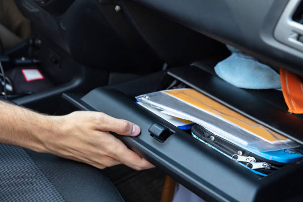 Driver Opening Glovebox Compartment Driver Hand Opening Glovebox Compartment Inside Car glove box stock pictures, royalty-free photos & images