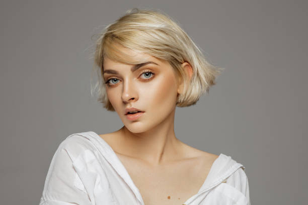 Beauty photo of cute blonde woman with short hair stock photo