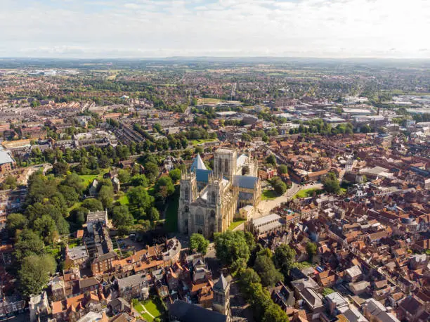 Aerial photo of the town of York located in North East England and founded by the ancient Romans, the photo shows The Minster Historical Cathedral and the main town centre along the river.
