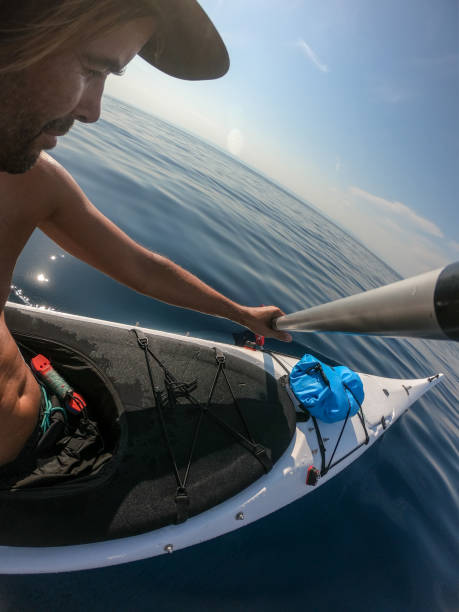 istock Man paddling an kayak closeup 1174301588