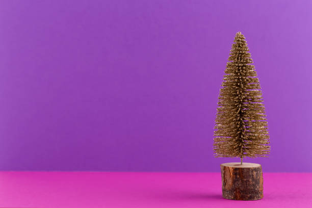 istock Christmas tree on pastel colored background. Christmas or New Year minimal concept. 1174302167