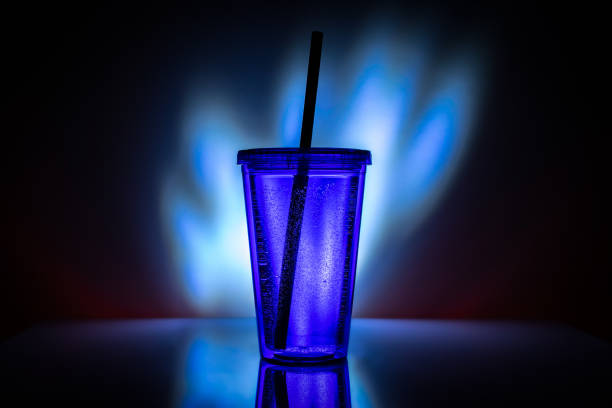 istock Cup of tea with black plastic straw. Drink cocktail background 1174304322