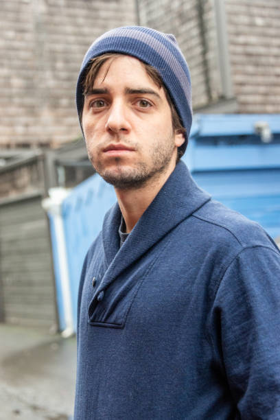 istock Serious young man wearing a toque hat looking at the camera 1174304499