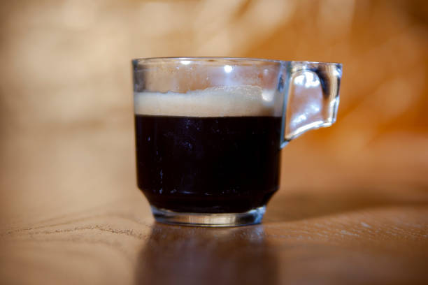 istock glass of coffee on black background 1174304709