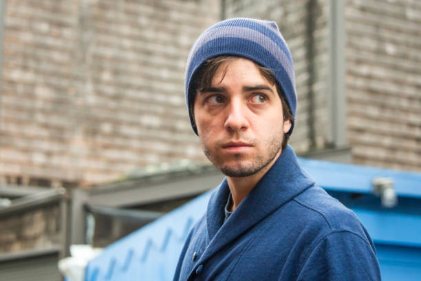istock Serious young man wearing a toque hat looking away 1174306250