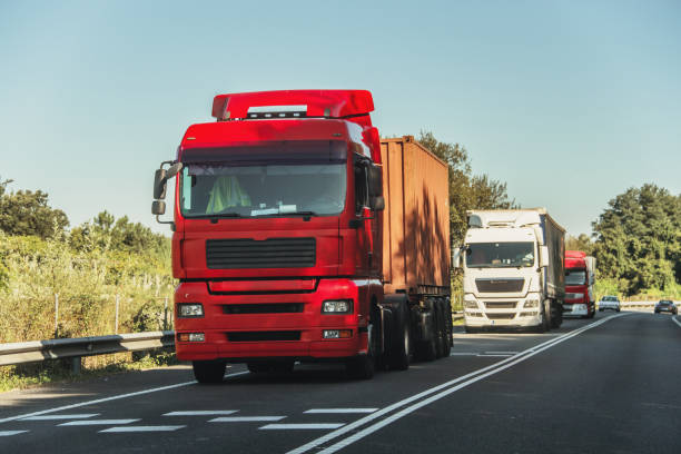 istock Large trailer trucks in a road 1174313860