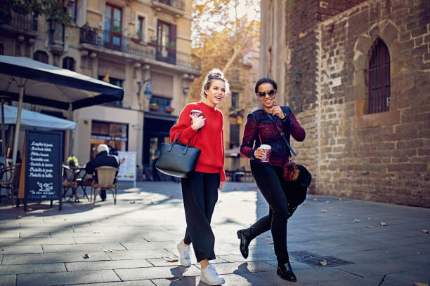 istock Happy girlfriends are exploring the gothic quarther 1174316730