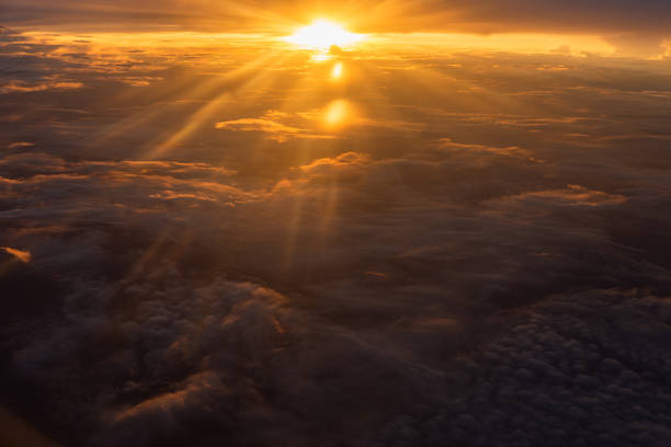 istock Beautiful sunlight  and sunset over cloudscape as seen through airplane 1174317837