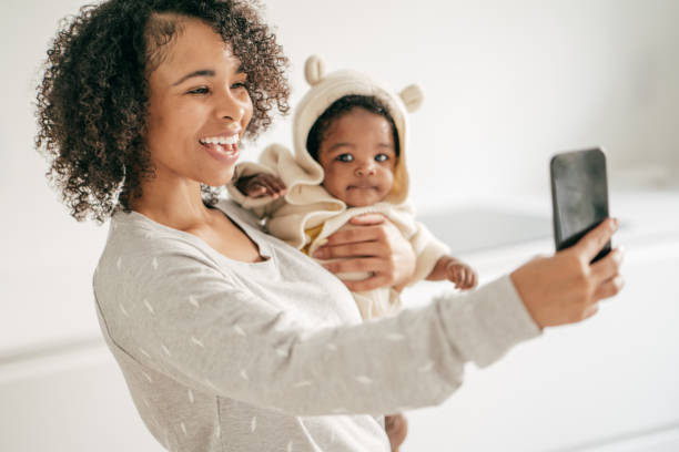 istock Baby and mother at home 1174318689