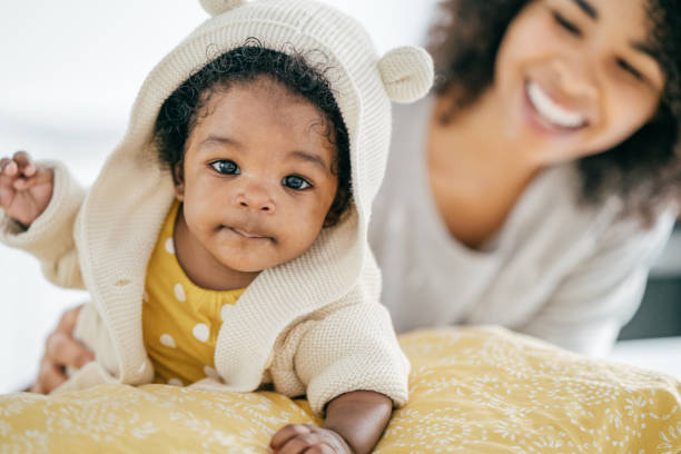 istock Baby and mother at home 1174318727