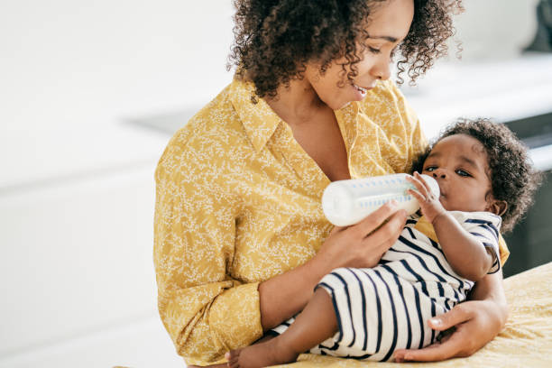 istock Baby and mother at home 1174318752