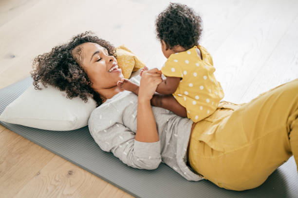 istock Baby and mother at home 1174318796