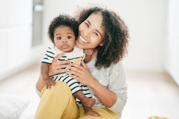 istock Baby and mother at home 1174318800