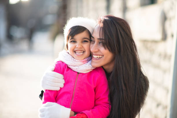 istock Smiling Muslim mother and child 1174321706