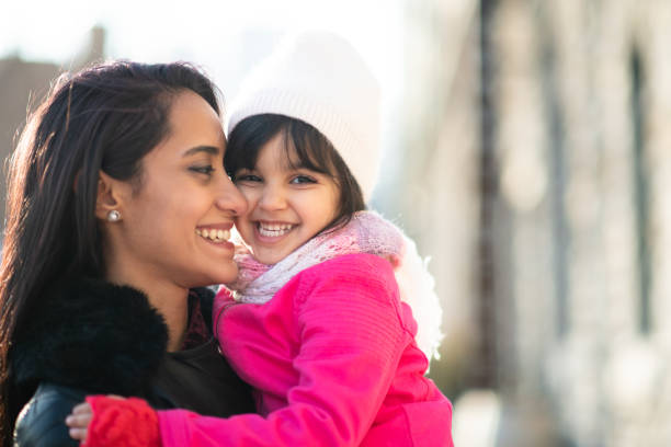 istock Smiling Muslim mother and child 1174321708