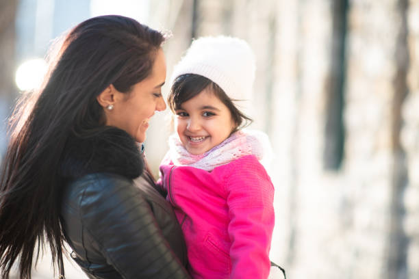 istock Smiling Muslim mother and child 1174321736