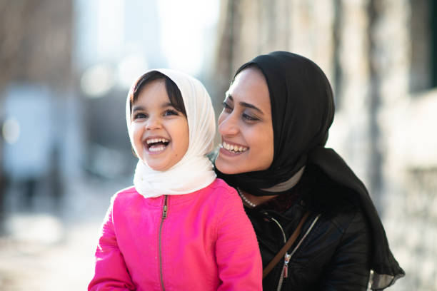 istock Muslim mother and daughter outside 1174321766