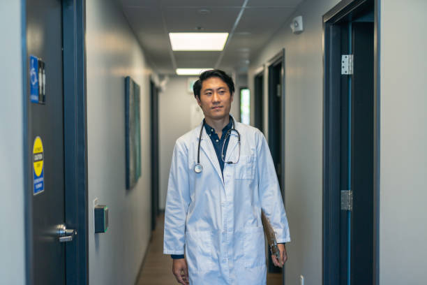 istock Doctor walking down hospital corridor 1174321884